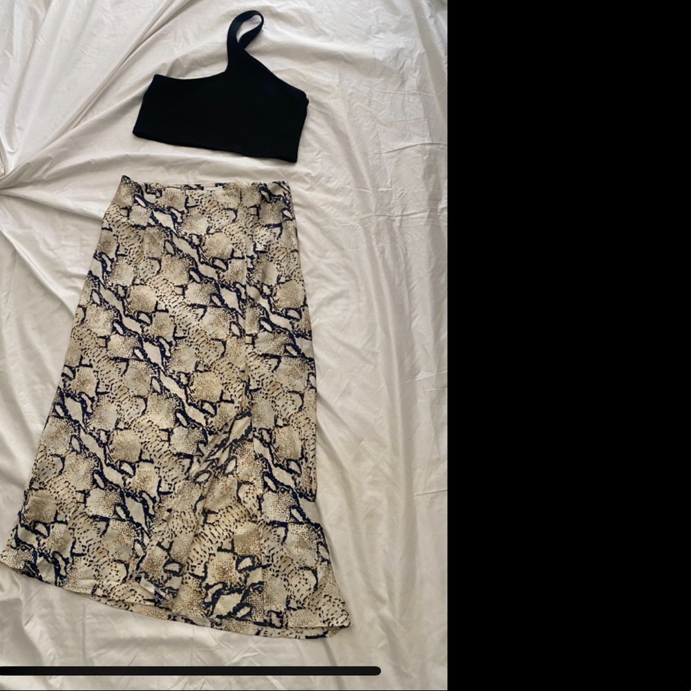 Cross body crop top. Black. Polyester/Rayon Viscose. Size M. Like new.